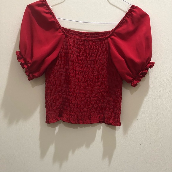 Ladies red short sleeve elastic pattern and buttons down front. Size M - Picture 2 of 2